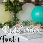 white-kids-corner-wooden-table-sign-wedding-party-event-font-1|LLWWKCMF1|Luck and Luck| 1